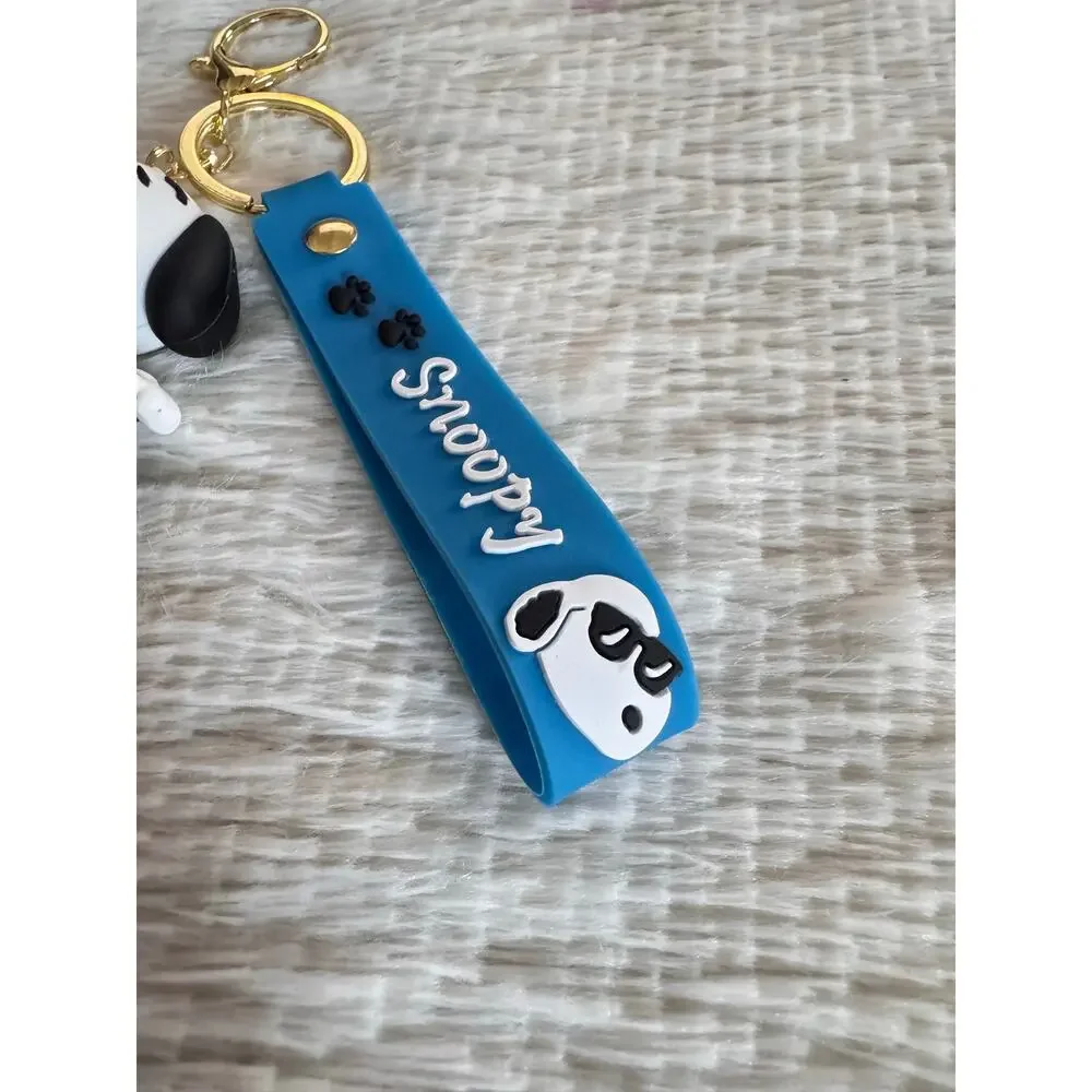 Snoopy with sweater keychain blue strap featuring white text and Snoopy graphic